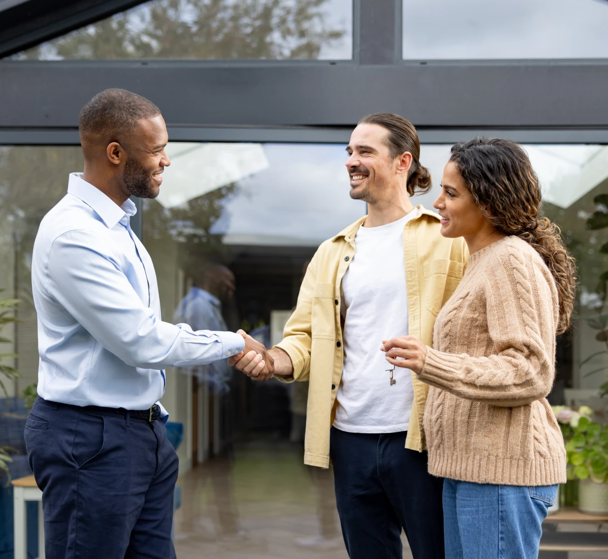 People shaking hands in a friendly meeting.