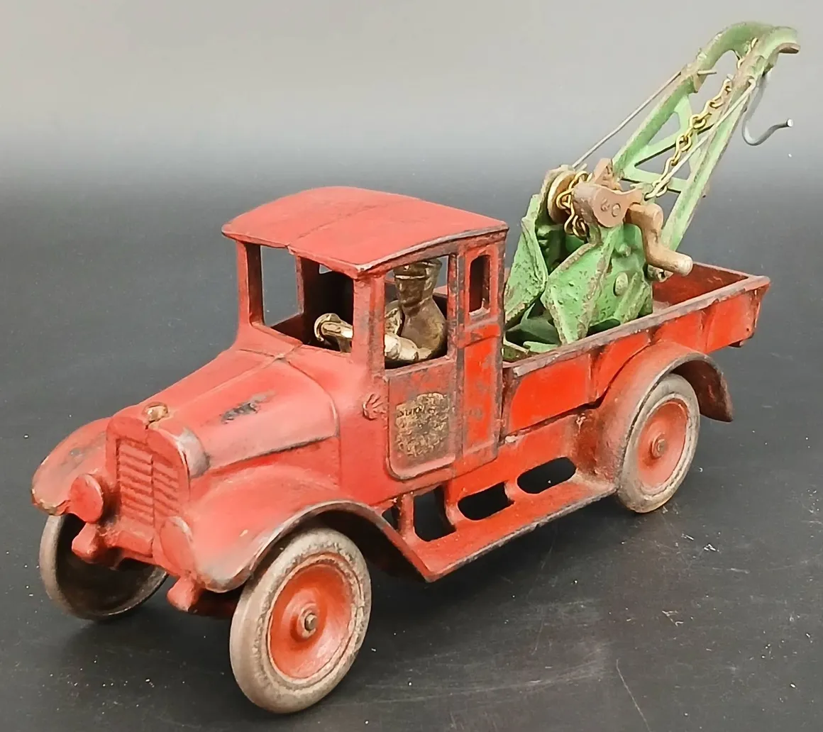 Antique metal tow truck toy