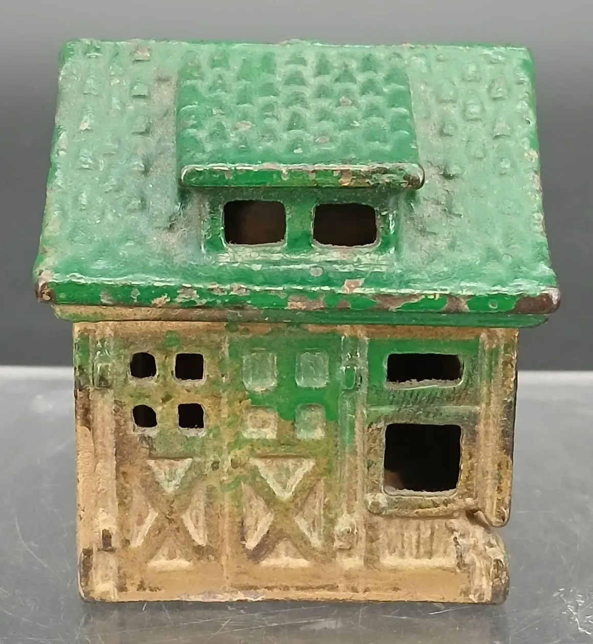 Antique toy house with windows and door