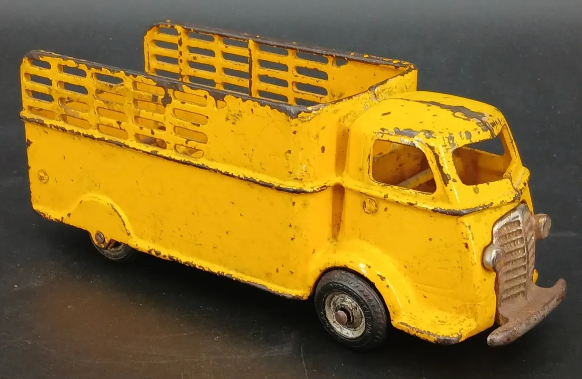 Vintage yellow toy truck with wear