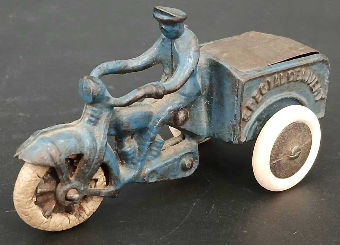 Blue metal toy motorcycle and rider